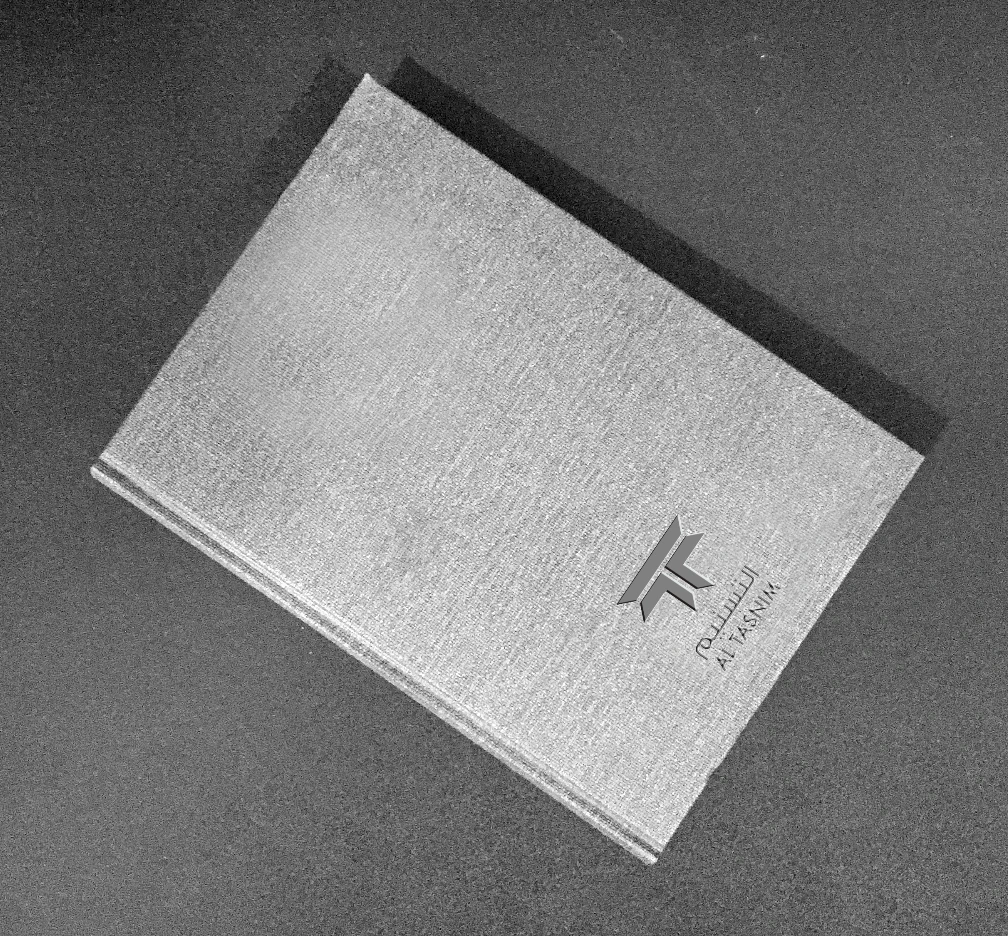 Al Tasnim mark embossed on stock