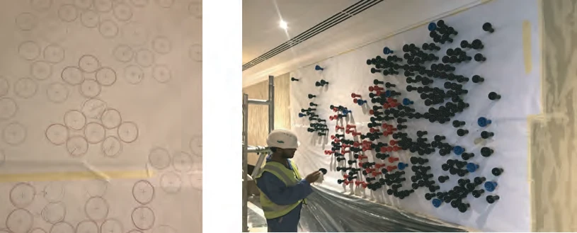 Installing the hookah art composition on the Cigar Lounge wall