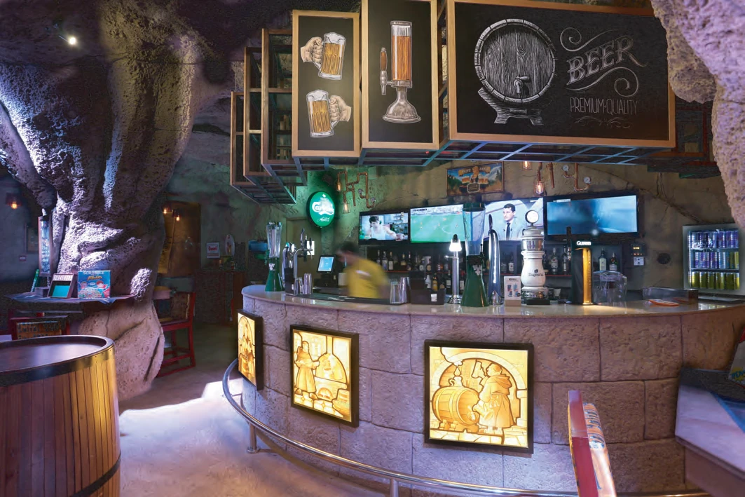 Interior of Monk's Tap House under warm lighting