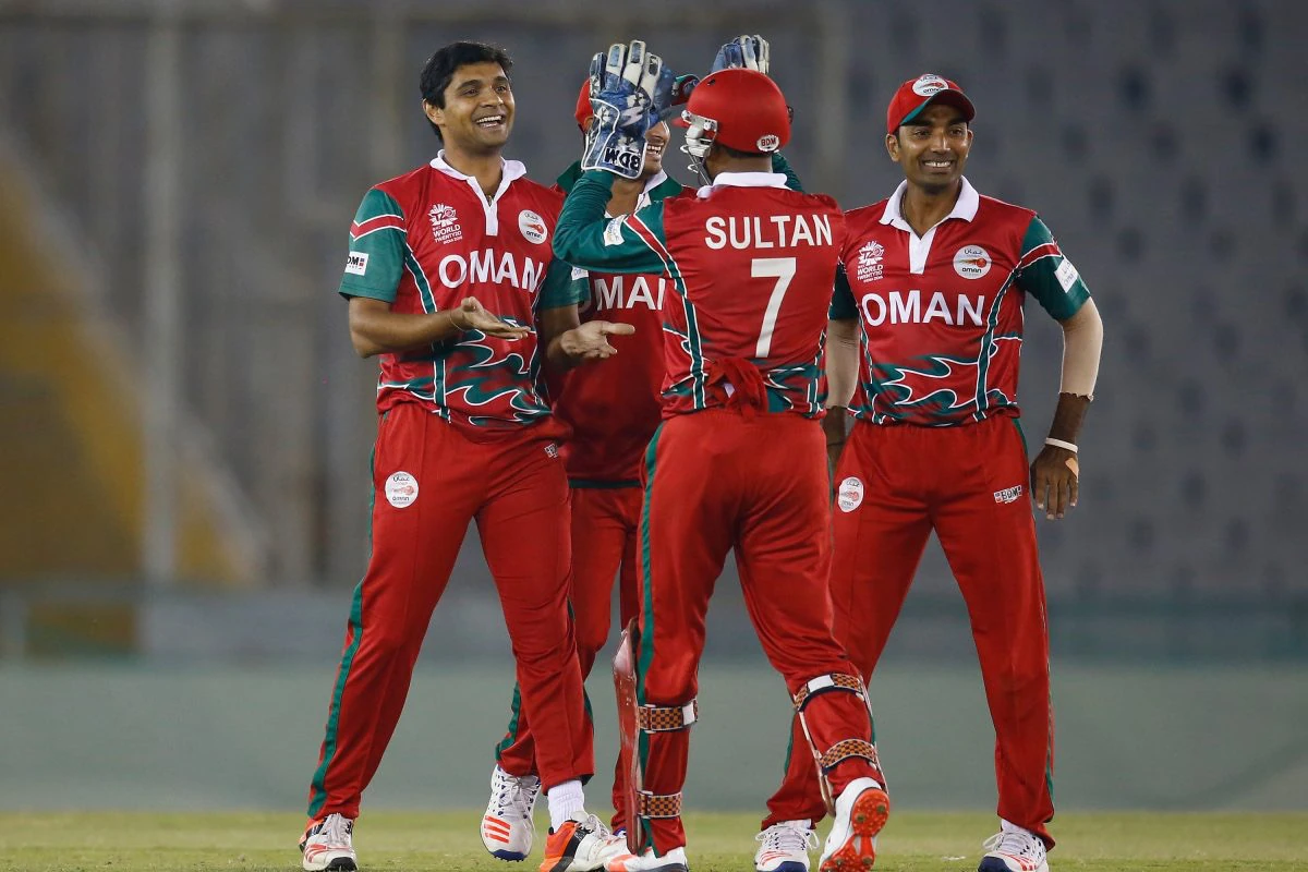 Oman cricketers in branded kit on the field